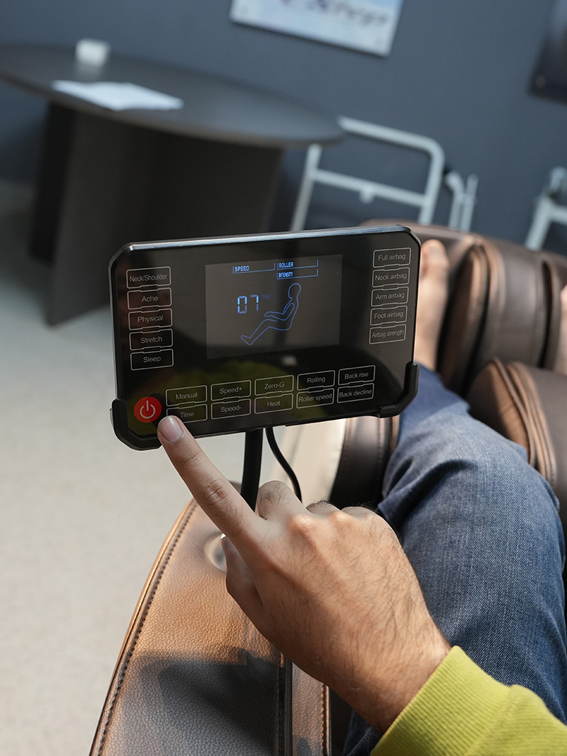 User operating massage chair remote control