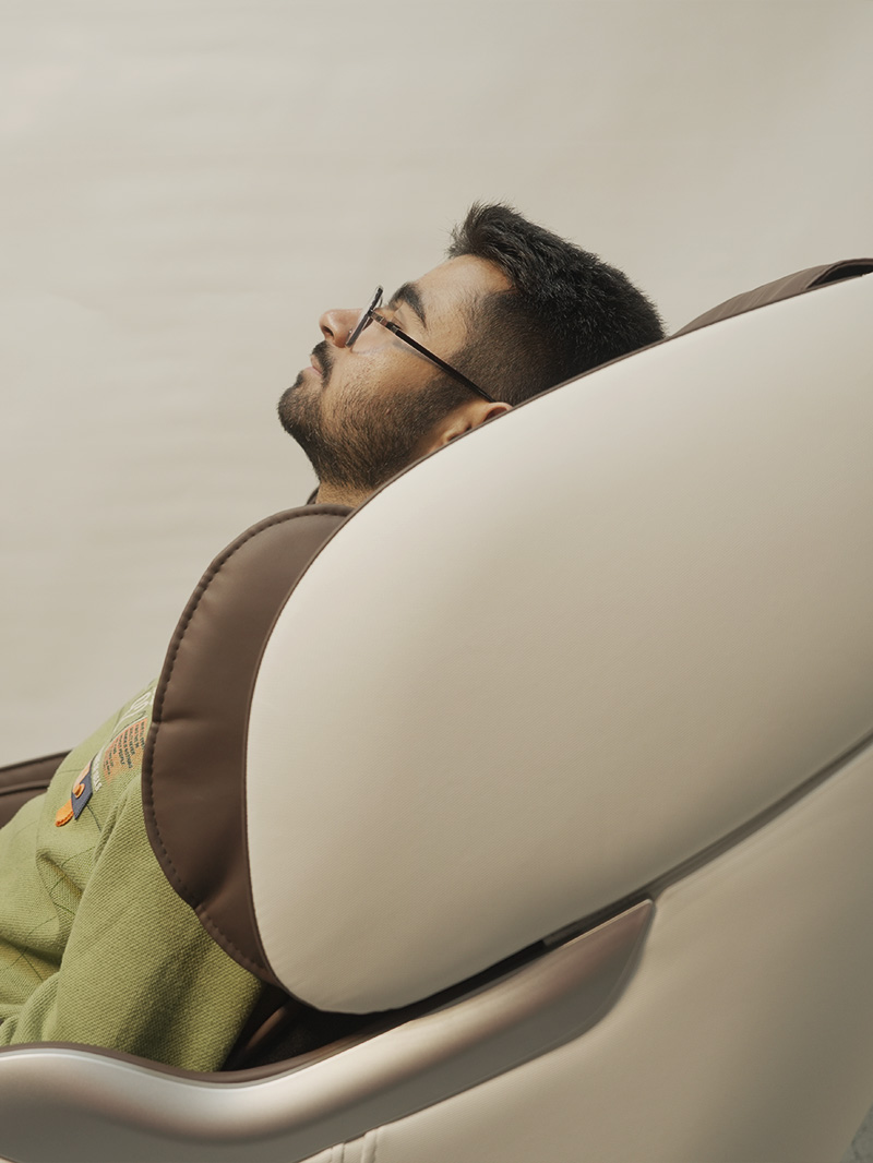 User relaxing in zero gravity massage position